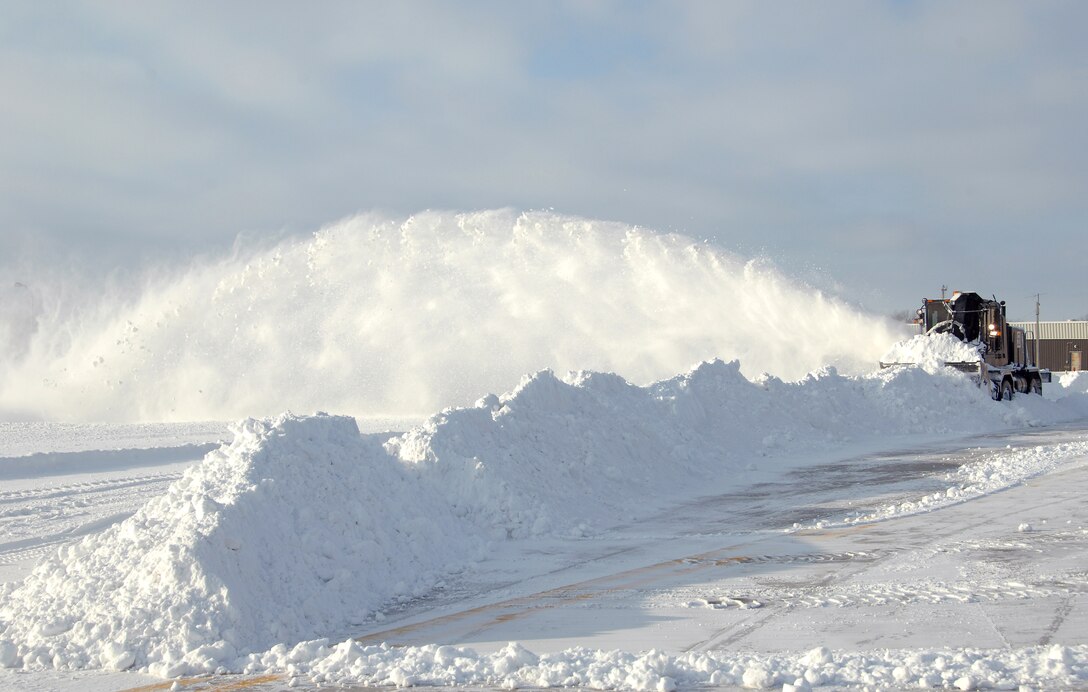 A snow blower operated by the 55th Civil Engineering Squadron’s heavy pavement shop removes a wall of snow from a taxiway at Offutt Air Force Base, Neb., Feb. 22. Offutt received eight inches of accumulation with the storm. (U.S. Air Force photo by Delanie Stafford/Released)