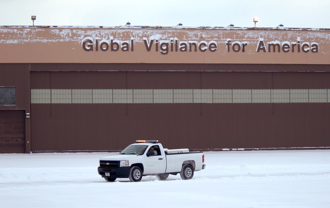 Kurt Kemp, a snow removal work leader commonly referred to as the “Snow Man” from the 55th Civil Engineering Squadron, coordinates snow clearing efforts from his pickup truck at Offutt Air Force Base, Neb., Feb. 22. Offutt received eight inches of accumulation with the storm. (U.S. Air Force photo by Delanie Stafford/Released)