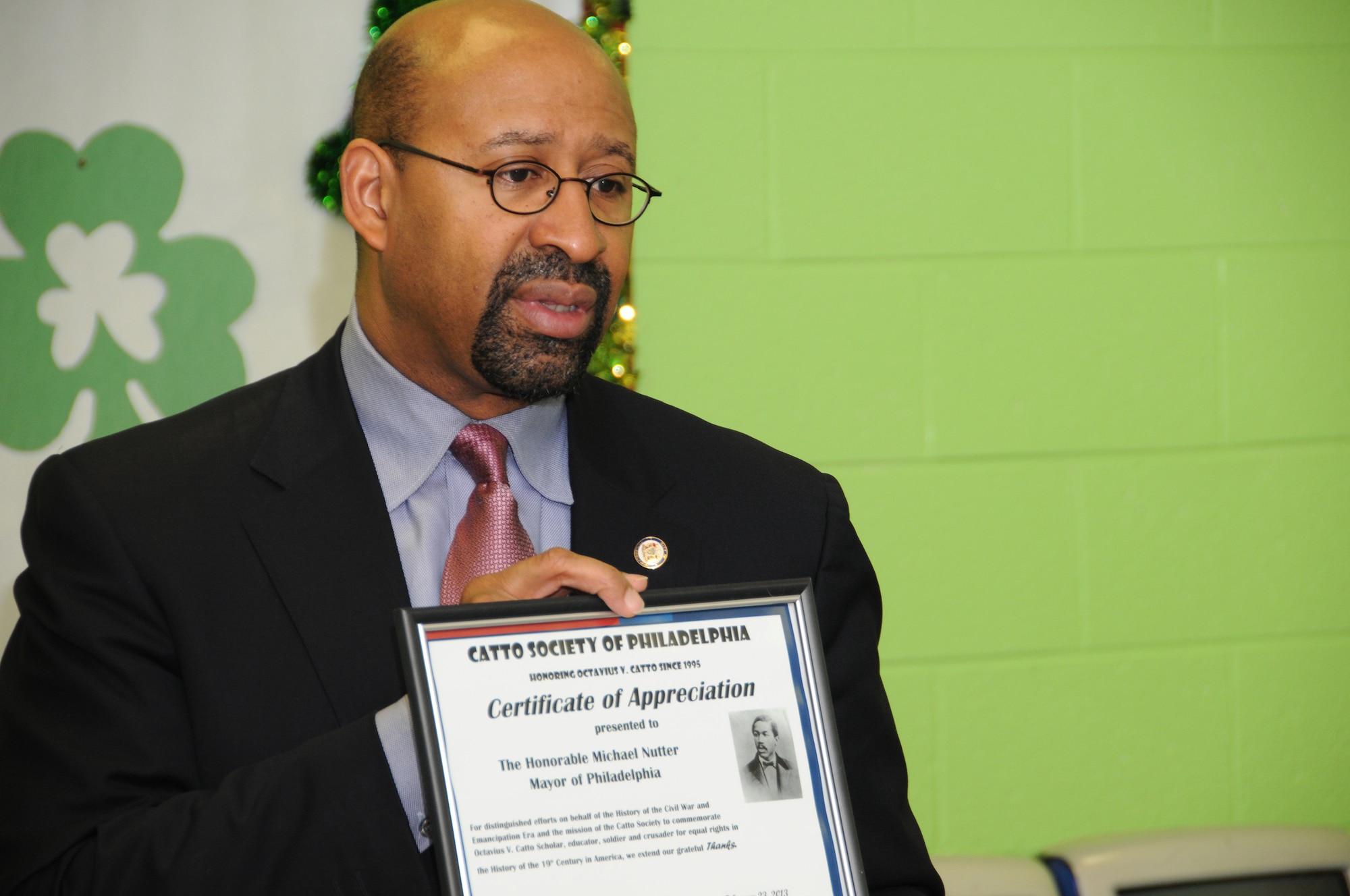 The Honorable Michael Nutter, mayor of Philadelphia, is presented a letter of appreciation from the Catto Society of Philadelphia on Feb. 23 during the 18th annual O.V. Catto Memorial Ceremony held at the Star Gardens Recreation Center at 6th and Lombard streets in Philadelphia. Mayor Nutter is the first mayor to have attended the ceremony.