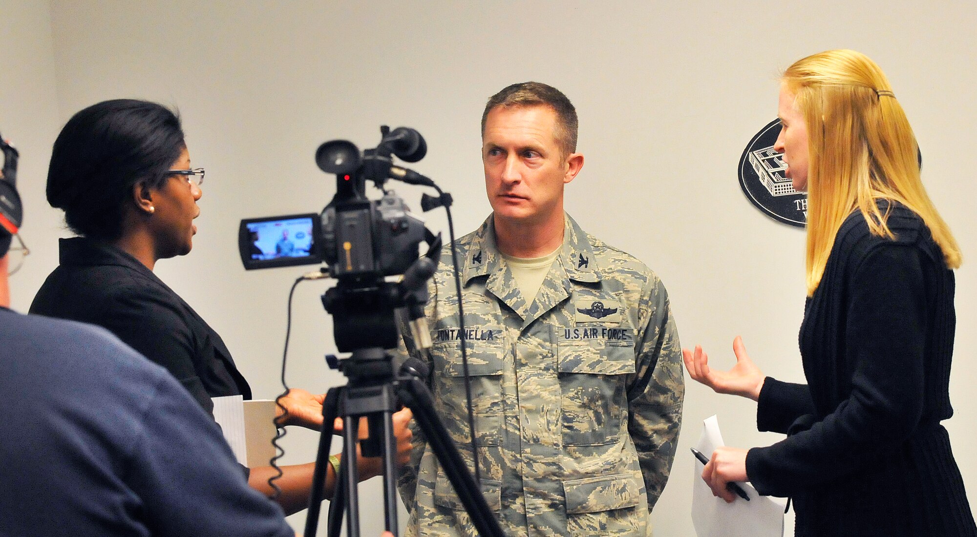 Left, Chandra Brown, Air Force Reserve Command media training program manager, and Heather Newcomb, AFRC Public Affairs deputy director, offer suggestions to Col. James Fontanella as he receives instructions on press conferences and meeting with the media. The training is designed to be as realistic as possible and can range from friendly interviews to dealing with aggressive reporters. (U.S. Air Force photo by Sue Sapp)