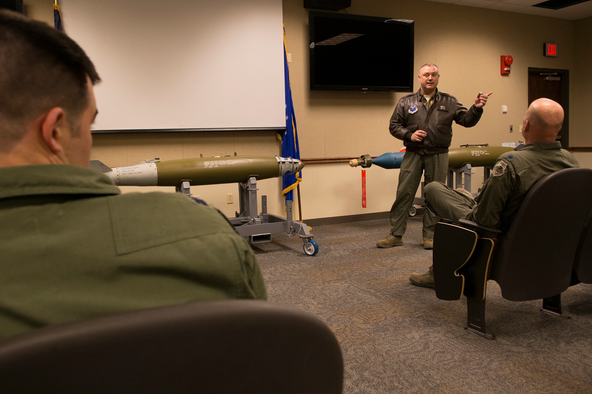 U.S. Air Force Lt. Col. Mark Ewart speaks after being presented the B-52 5000 flying hours pin, Mar. 6, 2013, Barksdale Air Force Base, La. Ewart is an academics director assigned to the 11th Bomb Squadron and reached this career milestone during a sortie on a 93rd Bomb Squadron B-52H Stratofortress. (U.S. Air Force photo by Master Sgt. Greg Steele/Released)