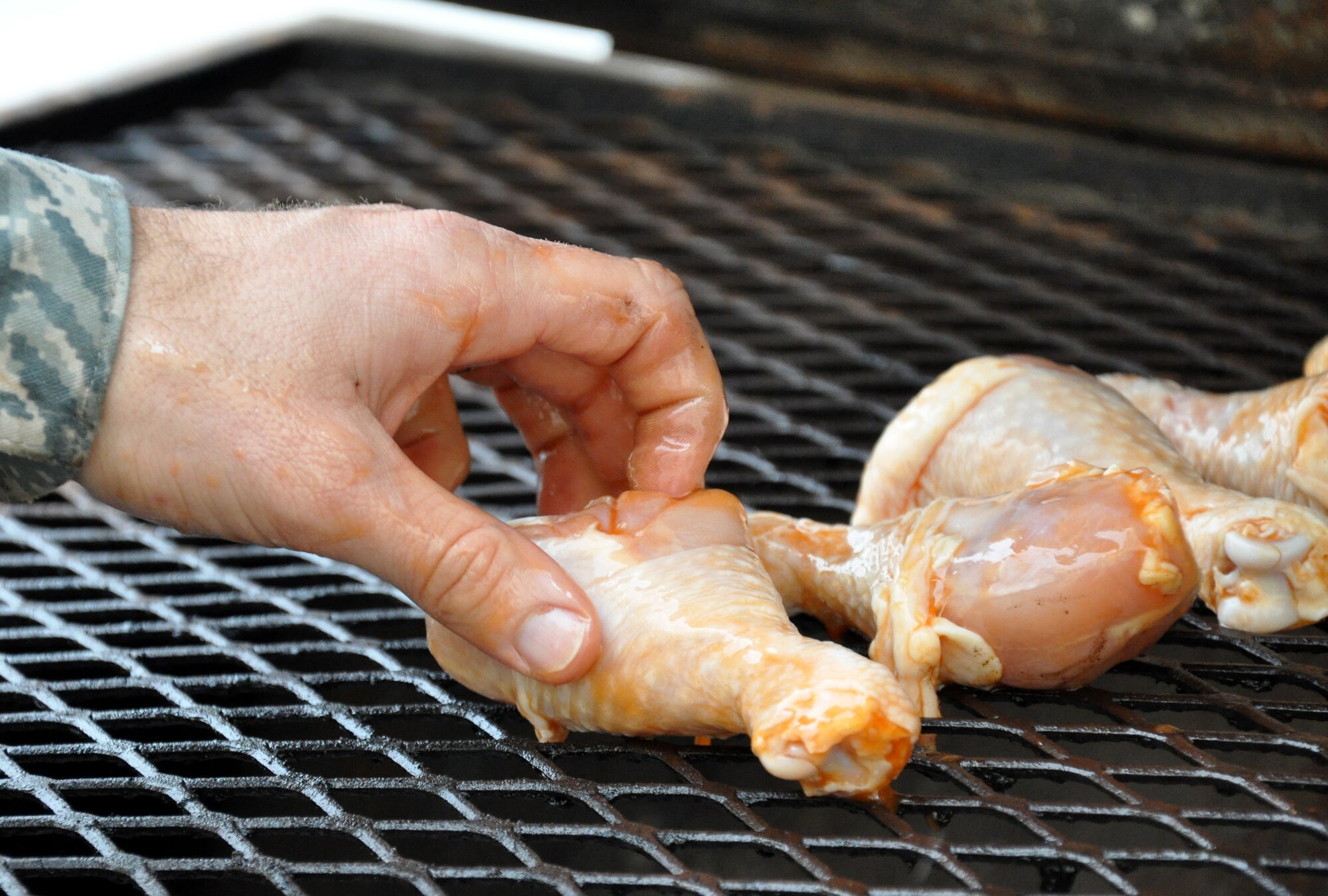 The base chaplain grills chicken during a 351st Expeditionary Air Refueling Squadron barbecue. The deployed base chaplain sponsored the barbecue March 7 and 8, 2013, at 5 p.m. and midnight to accommodate day and night-shift workers. Airmen from the 100th Air Refueling Wing deployed to southwest Europe in January 2013 as the 351st EARS to refuel French fighter aircraft conducting operations in Mali. Since Jan. 27, 2013, the 351st EARS Airmen have flown KC-135 Stratotankers delivering more than 3-million pounds of fuel to French aircraft. (U.S. Air Force photo by Capt. Jason Smith)