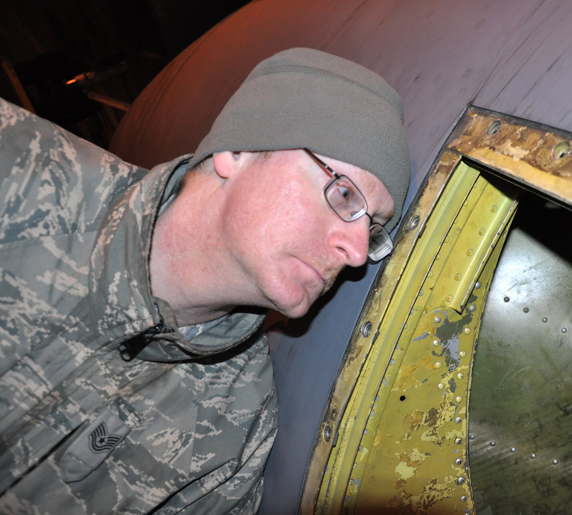 Tech. Sgt. Michael Mackey, 100th Aircraft Maintenance Squadron, monitors Airman 1st Class Brandon Baker, 100th AMXS, March 8, 2013, at a deployed location in southwest Europe. Baker was in the aft-tail compartment of a KC-135 Stratotanker replacing the pitch servo motor. Airmen from the 100th Air Refueling Wing deployed to southwest Europe in January 2013 as the 351st EARS to support French operations in Mali. Since Jan. 27, 2013, the 351st EARS Airmen have delivered more than 3-million pounds of fuel to French aircraft. (U.S. Air Force photo by Capt. Jason Smith)
