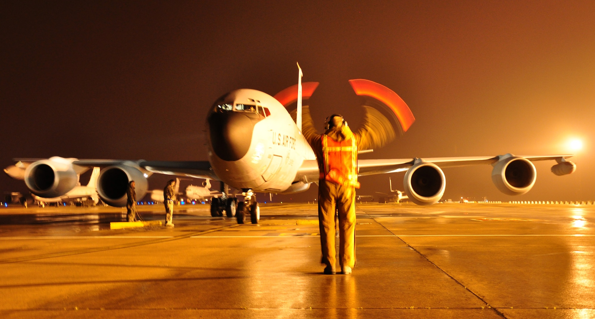 Senior Airman Joseph Ulicny, 100th Aircraft Maintenance Squadron, marshals a KC-135 Stratotanker March 8, 2013, at a deployed location in southwest Europe. The crew and aircraft from the 351st Expeditionary Air Refueling Squadron returned from a mission where they refueled French fighter aircraft over Africa. Airmen from the 100th Air Refueling Wing deployed to southwest Europe in January 2013 as the 351st EARS to support French operations in Mali. Since Jan. 27, 2013, the 351st EARS Airmen have delivered more than 3-million pounds of fuel to French aircraft. (U.S. Air Force photo by Capt. Jason Smith)