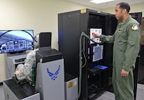 Air Force Staff Sgt. Jason Boyd and Tech. Sgt. Andre Scott, 359th Aeromedical Squadron Aerospace and Operational Physiology Flight craftsmen, conduct tests on the new hypoxia familiarization trainer Feb. 21 at Joint Base San Antonio-Randolph. (U.S. Air Force photo by Benjamin Faske/ Released)