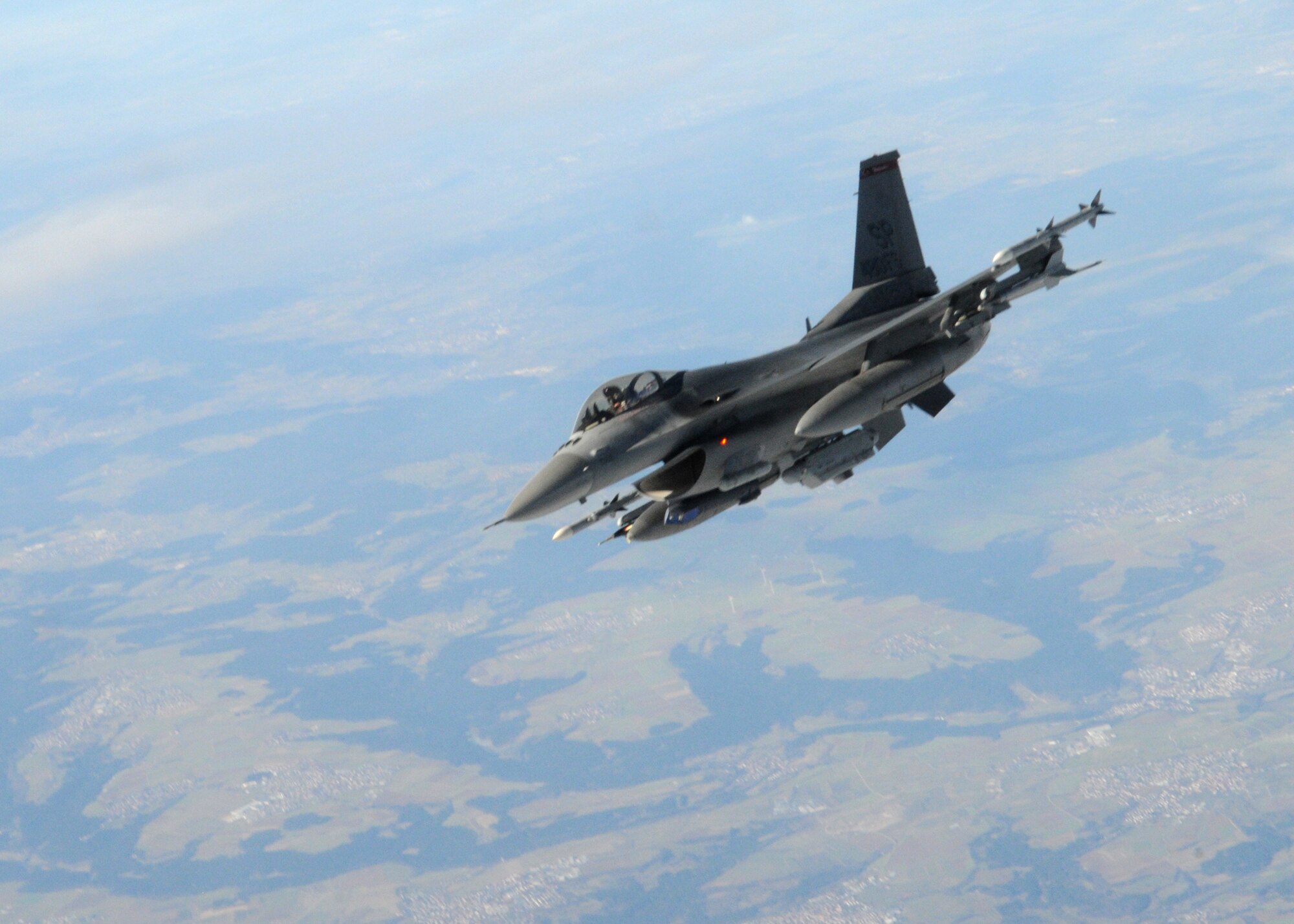 An F-16 Fighting Falcon from the 52nd Fighter Wing, Spangdahlem, Air Base Germany breaks away from a KC-135 Stratotanker from the 100th Air Refueling Wing, RAF Mildenhall, England, after completing a refueling mission Mar. 7, 2013, over Germany. The F-16 is a multi-role fighter aircraft and relies on refueling aircraft like the KC-135 to keep it in the air on longer sorties. (U.S. Air Force photo by 1st Lt. Christopher Mesnard/Released)