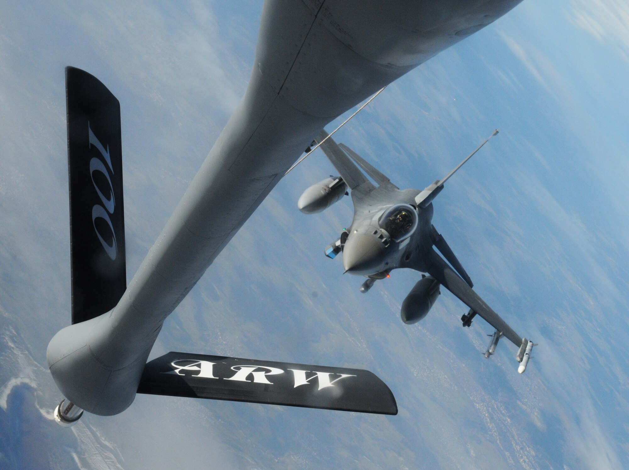An F-16 Fighting Falcon from the 52nd Fighter Wing, Spangdahlem, Air Base Germany, approaches the boom on a KC-135 Stratotanker from the 100th Air Refueling Wing, RAF Mildenhall, England, during a refueling mission Mar. 7, 2013, over Germany. The 100th ARW provides fuel to combat and support aircraft in the European and African areas of responsibility, providing a vital support role to the U.S. Air Force fleet of aircraft.  (U.S. Air Force photo by 1st Lt. Christopher Mesnard/Released)