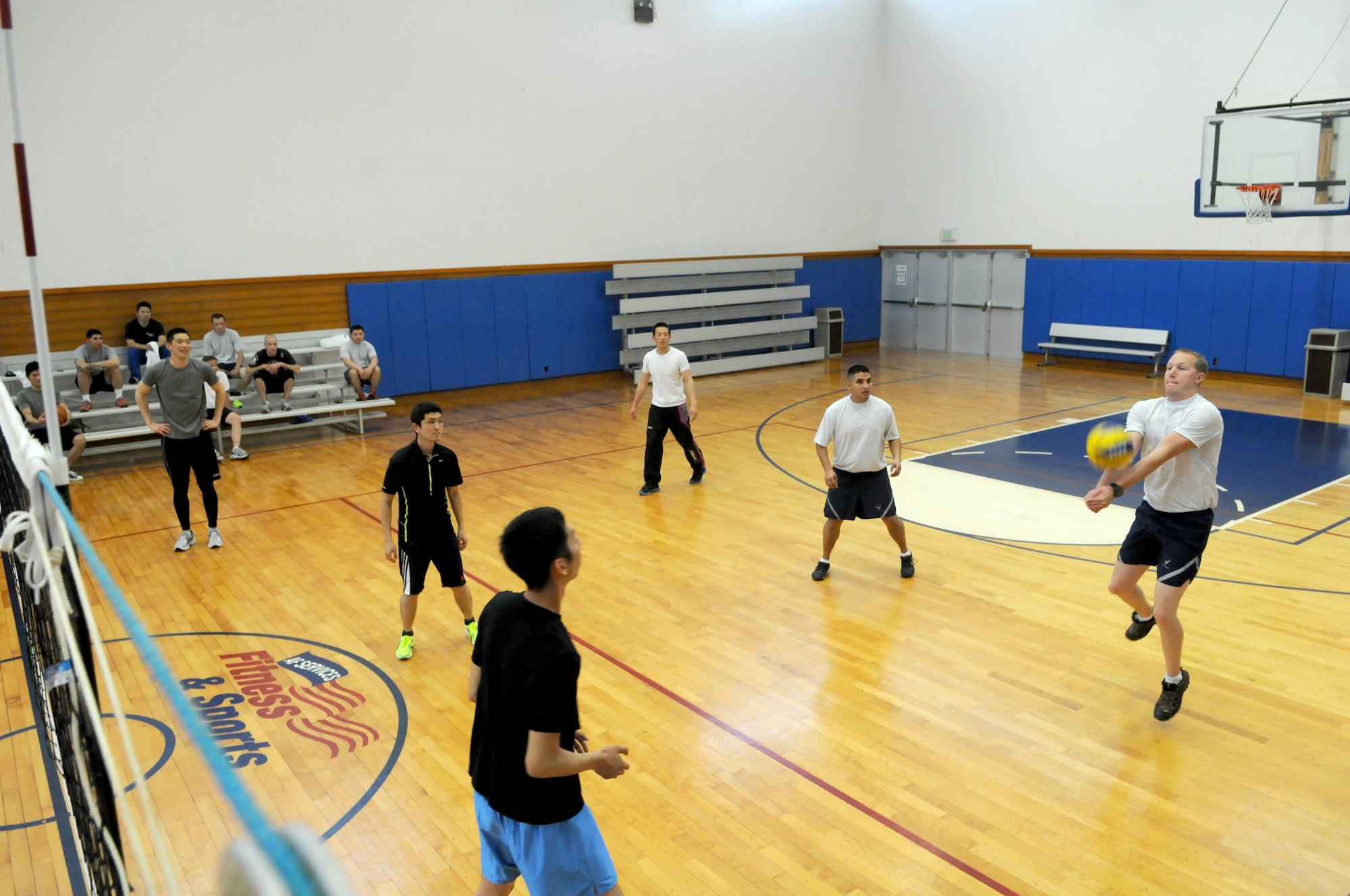 U.S. Air Force and Japanese Self Defense Ground Force NCOs participate in a volleyball challenge against 18th Wing chief master sergeants and first sergeants on Kadena Air Base, Japan, Feb. 27, 2013. In addition to working together during the 2013 JASDF NCO Bilateral Exchange, the Kadena and JASDF NCO partners spent time team building. (U.S. Air Force photo/Tech. Sgt. Amanda Savannah)