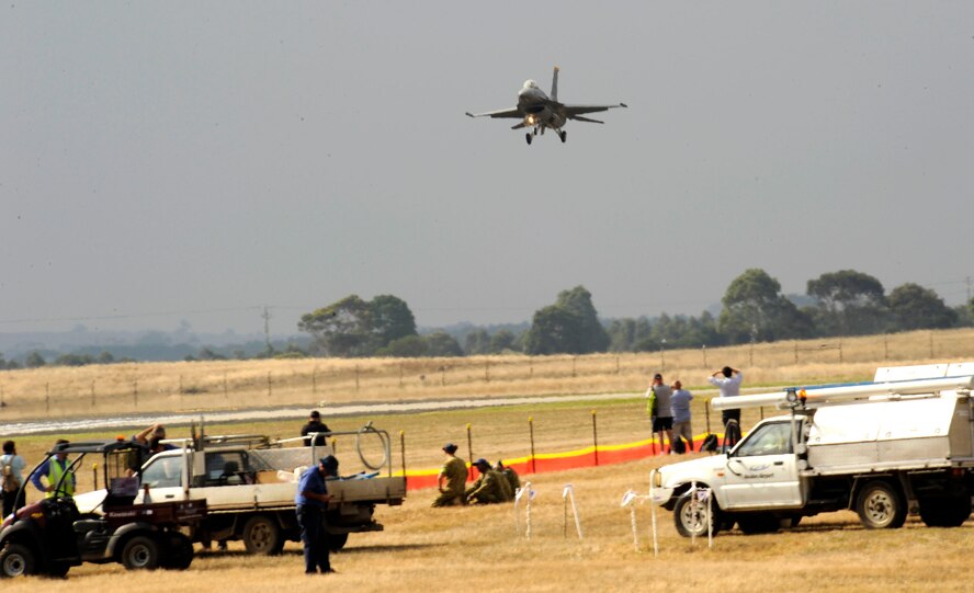 Australian International Airshow 2013 attendees watch an F-16 Fighting Falcon, from Misawa Air Base, Japan, land on the runway at Avalon Airport, Australia, Feb. 26. This event, which is one of the largest international trade shows in the Pacific, drew over 350,000 visitors and featured 500 defense exhibitioners from 35 countries. (U.S. Air Force photo by Airman 1st Class Kenna Jackson)