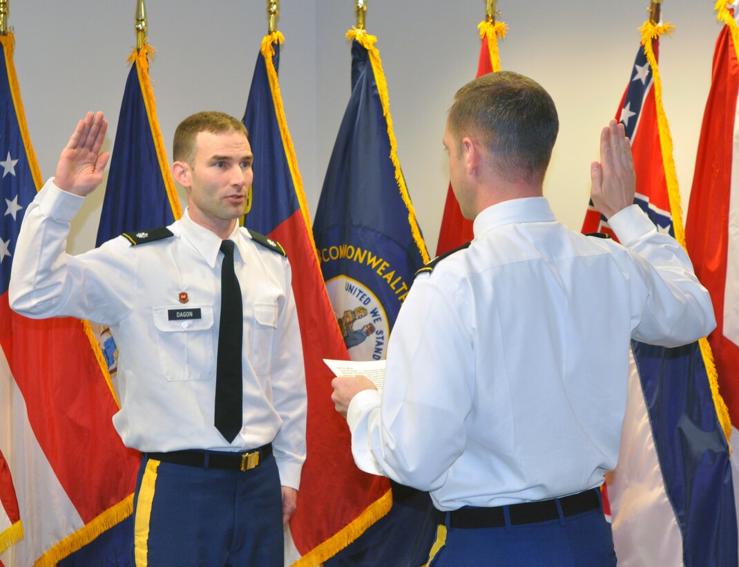 Lt. Col. James A. DeLapp, Nashville District commander, administers the oath of office to his Deputy District commander, Lt. Col. Patrick Dagon during a promotion ceremony at the Nashville District headquarters, March 8, 2013. Dagon has been with the Nashville District since Aug 2011. His next assignment is with the Defense Threat Reduction Agency at Kirtland Air Force Base, Albuquerque, N.M., with a report date in August. (USACE photo by Mark Rankin)