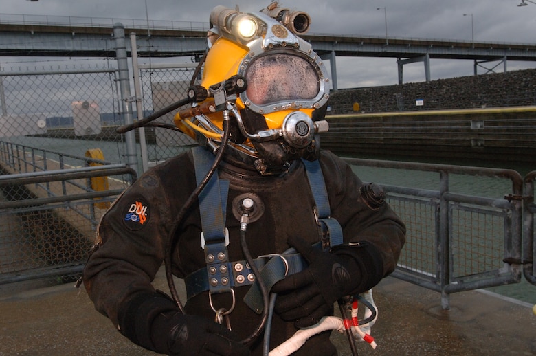 Diver Jeff Neely, U.S. Army Corps of Engineers Nashville District Dive Team, prepares to descend into Pickwick Lock in Counce, Tenn., March 5, 2013 to inspect components ahead of scheduled maintenance later this year. (USACE photo by Lee Roberts)