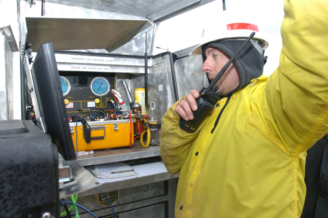 Ross Cunningham,  diver and lock and dam equipment maintenance supervisor from the Cumberland River Operations Center in Old Hickory, Tenn., monitors a dive operation at Pickwick Lock in Counce, Tenn., March 5, 2013.  The dive team inspected components ahead of scheduled maintenance later this year. (USACE photo by Lee Roberts)