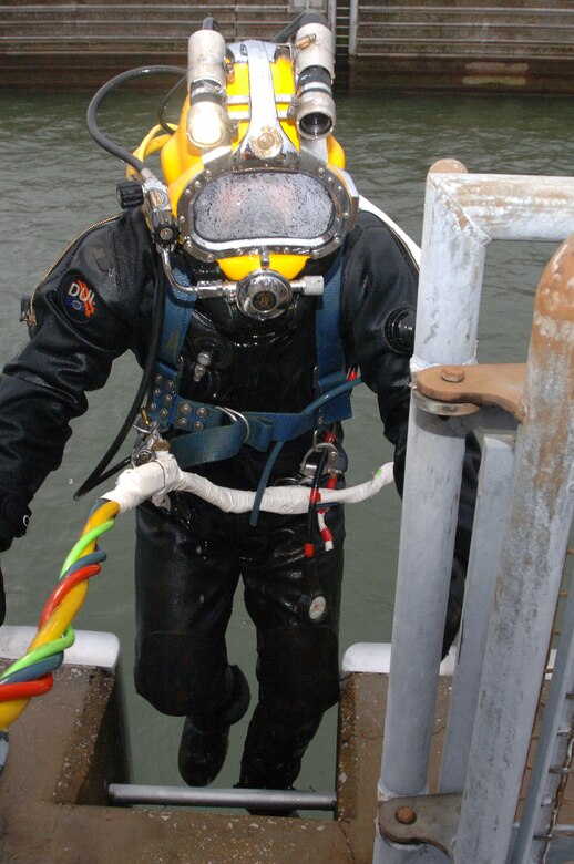 Diver Jeff Neely, U.S. Army Corps of Engineers Nashville District Dive Team, returns to the surface at Pickwick Lock in Counce, Tenn., March 5, 2013 where he inspected components ahead of scheduled maintenance later this year. (USACE photo by Leon Roberts)
