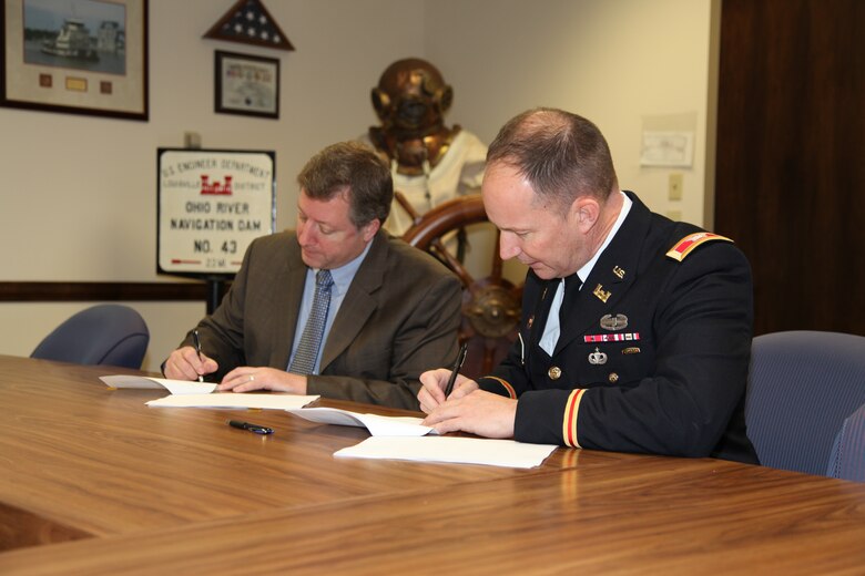 Louisville District Commander Col. Luke Leonard (right) and Terry Cook, State Director of The Nature Conservancy, signed a Cost Share Agreement for the Green River Watershed Assessment March 6. 