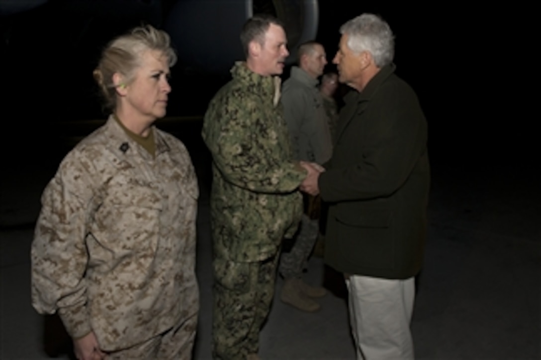 Secretary of Defense Chuck Hagel greets service members at Manas Air Base, Kyrgyzstan, on March 8, 2013.  Hagel took the opportunity to talk briefly with service members as he changed planes before continuing on to Afghanistan.  Hagel is traveling to Afghanistan on his first trip as secretary of defense to visit U.S. troops, NATO leaders, and Afghan counterparts.  