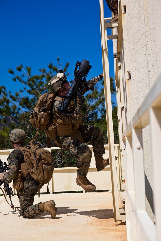 Lance Cpl. Cody G. Underwood, a Shoulder-Launched, Multipurpose Assault Weapon (SMAW) gunner with Company C., Battalion Landing Team 1st Battalion, 5th Marine Regiment, 31st Marine Expeditionary Unit, and a native of Albia, Iowa, climbs the side of a building to provide security during a helicopter raid here, March 9. The helicopter raid was the final event of the 31st MEU’s Amphibious Integration Training, where the Marines embarked with Amphibious Squadron 11 sharpened their skills while operating from Navy vessels. The 31st MEU is the only continuously forward-deployed MEU and is the Marine Corps’ force in readiness in the Asia-Pacific region.