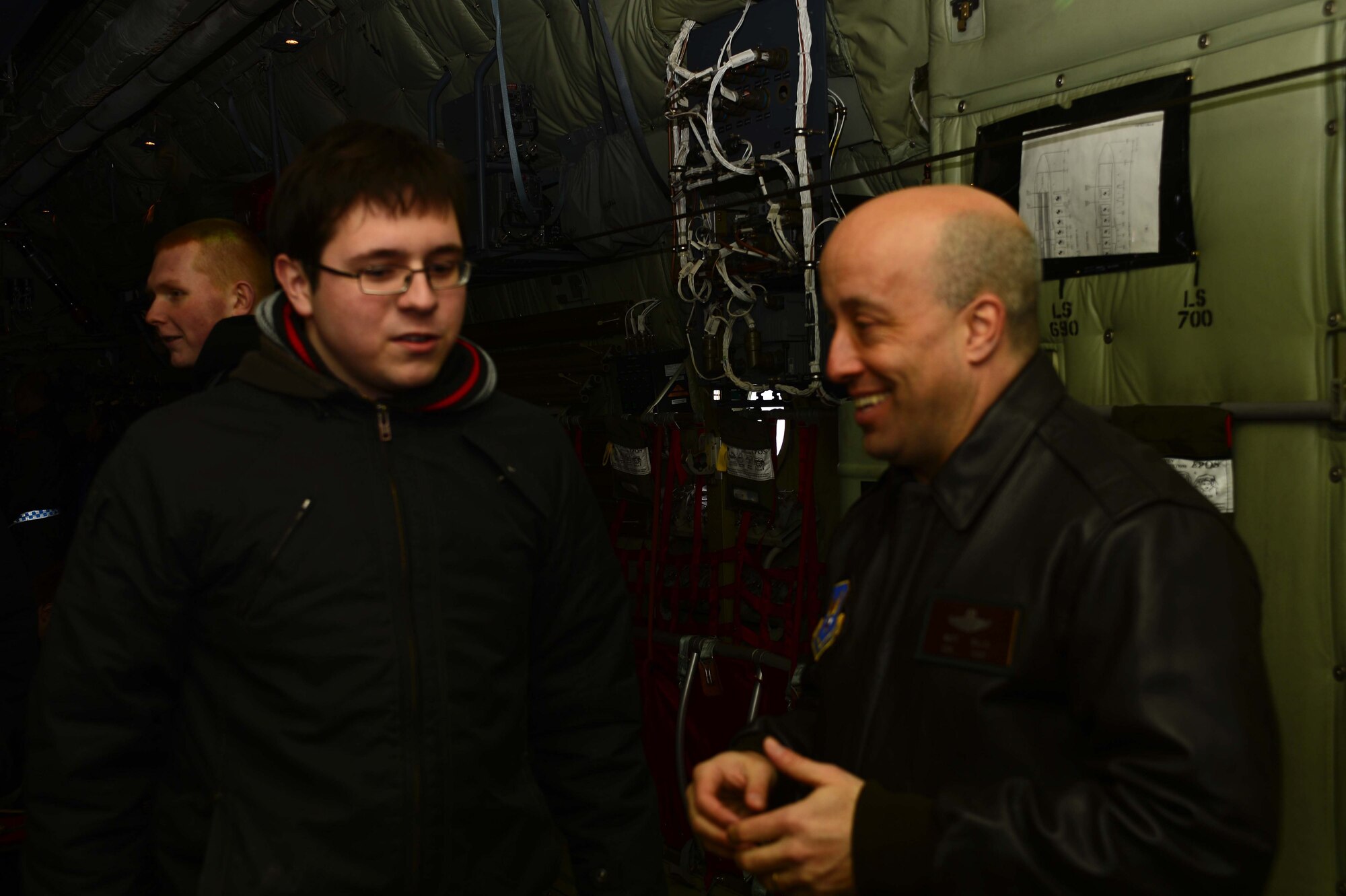 POWIDZ AIR BASE, Poland — (left) Patryk Staniszewski, a second year student at the Zespol Szkol Technical High School speaks with U.S. Air Force Col. Matthew Willis, U.S. Embassy air attaché to Poland, during a community outreach tour of a C-130J Super Hercules at Powidz Air Base, Poland, March 8, 2013. Willis visited the 33rd Air Transportation Base for a meet and greet during Exercise Screaming Eagle V, a U.S.-Polish bilateral exercise aimed at strengthening interoperability between the United States and Poland. (U.S. Air Force photo/Tech. Sgt. Kenya Shiloh)(released)