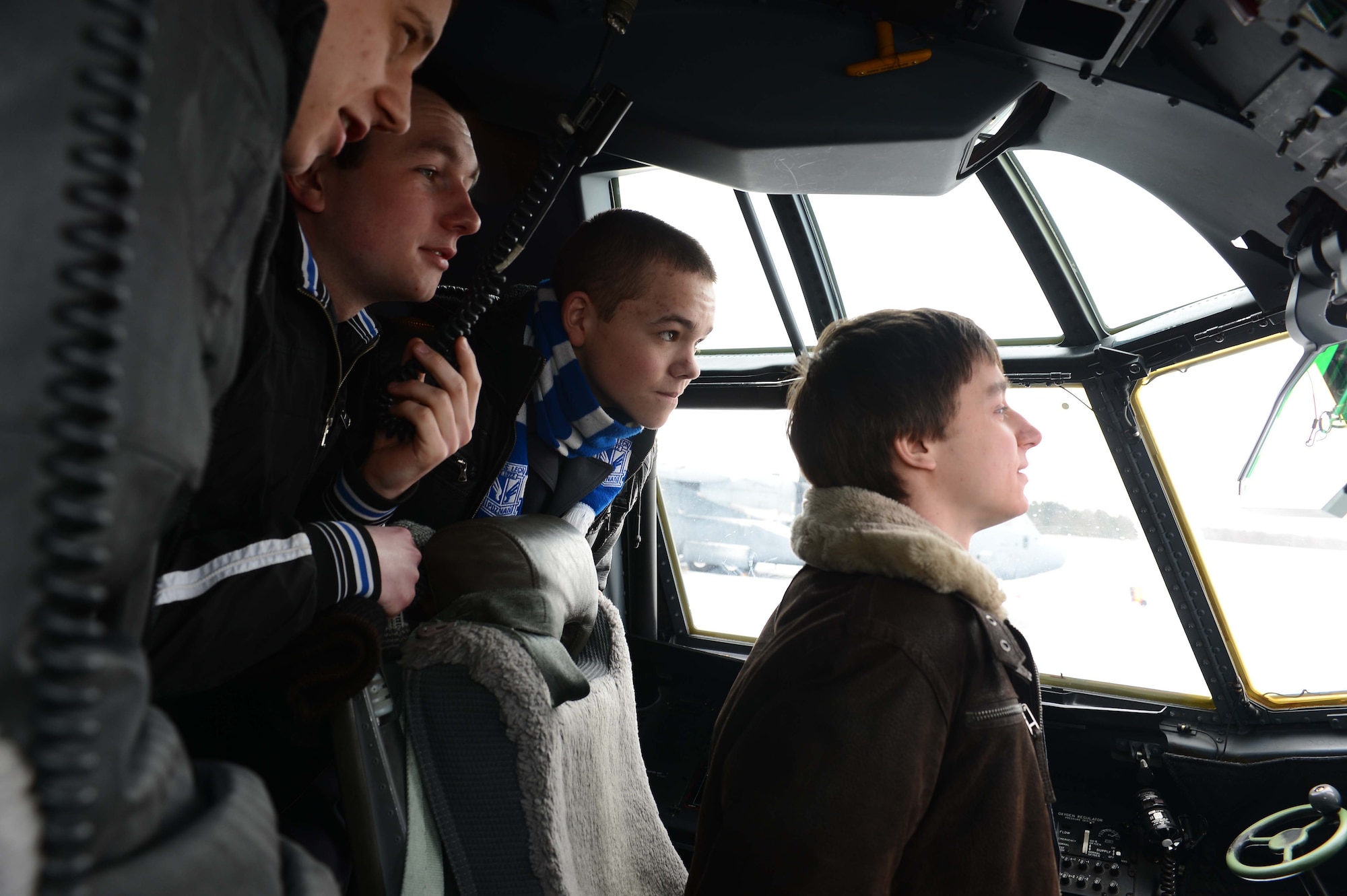 POWIDZ AIR BASE, Poland — A group of secondary school students from the Zespol school district view the features of a C-130J Super Hercules cockpit during a community outreach day at Powidz Air Base, Poland, March 8, 2013. Two C-130s and a group of nearly 60 U.S. military personnel from Ramstein Air Base, Germany, were in Poland for Exercise Screaming Eagle V, a bilateral training exercise hosted by Aviation Detachment 1, 52nd Operations Group, Lask Air Base, Poland. The Av-Det was activated in October 2012 after a Memorandum of Understanding was signed by the Polish Defense Minister authorizing a U.S. continued presence in the region. (U.S. Air Force photo/Tech. Sgt. Kenya Shiloh)(released)