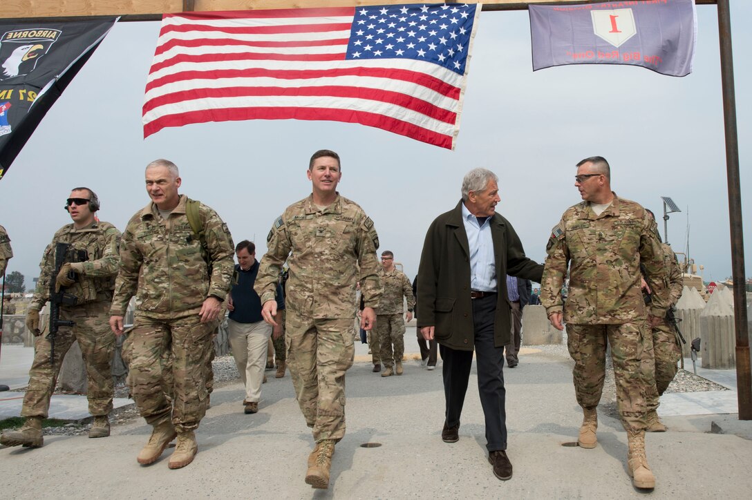 U.S. Defense Secretary Chuck Hagel walks with U.S. Army Lt. Gen. James Terry, commander of the International Security Assistance Force Joint Command, U.S. Army Col. Joseph McGee and  Command Sgt. Maj. Thomas Eppler in Jalalabad, Afghanistan, March 9, 2013. 