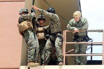 Marines from 9th ESB practice fast-rope and rappel training March 5 on Naval Base Guam. The Marines were re-qualifying to prepare for fast-roping out of helicopters during Guahan Shield, an exercise designed to facilitate multiservice engagement and provide potential response to theater crises and contingency operations in the Asia-Pacific region. 