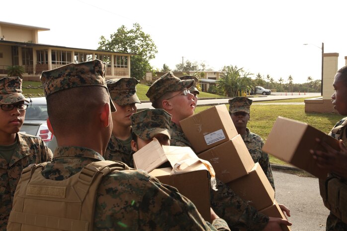 Marines with Combat Logistics Detachment 39 transport food for distribution to fellow Marines Feb. 13 on NCTS during exercise Guahan Shield.  Guahan Shield will facilitate multiservice engagements, set conditions for bilateral and multilateral training opportunities, and support rapid response to potential theater crises and contingency operations in the Asia-Pacific region.  Combat Logistics Detachment 39 is part of 9th Engineer Support Battalion, 3rd Marine Logistics Group, III Marine Expeditionary Force. 