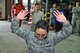 Senior Airman Senovia Gallegos puts her hands in the air and is apprehended by Senior Airman Joshua Lobato after he was sprayed in the face with pepper spray here March 10. Both are Reservists assigned to the 477th Security Forces Squadron and participated in OC training. The 477th Security Forces Squadron stood up under the 477th Fighter Group March 1. (U.S. Air Force Reserve/Tech. Sgt. Dana Rosso) 