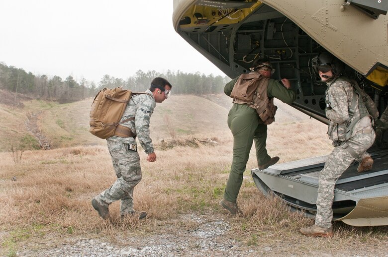 Alabama Air National Guard members from the 117th Air Refueling Wing arrive in a remote area to participate in a Survival, Evasion, Resistance and Escape (SERE) exercise. The purpose of the training is for pilots, boom operators and crew chiefs to know what to do if their aircraft goes down behind enemy lines. (U.S. Air Force photo by Master Sgt. David Maxwell) 
