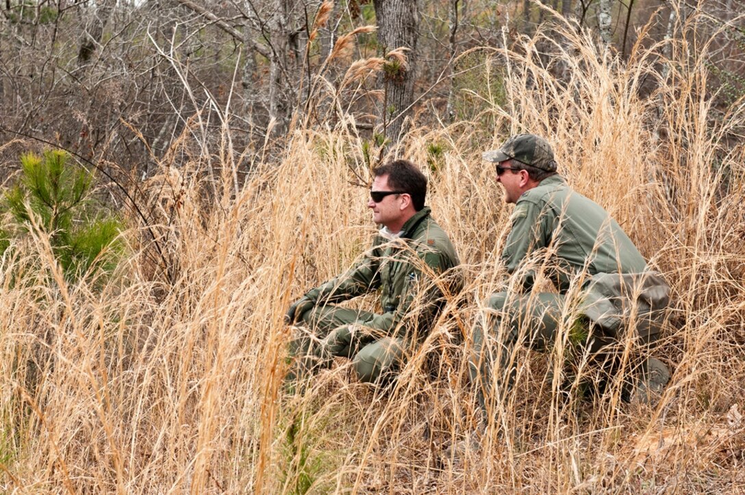 Alabama Air National Guard members from the 117th Air Refueling Wing arrive in a remote area to participate in a Survival, Evasion, Resistance and Escape (SERE) exercise. The purpose of the training is for pilots, boom operators and crew chiefs to know what to do if their aircraft goes down behind enemy lines. (U.S. Air Force photo by Master Sgt. David Maxwell) 