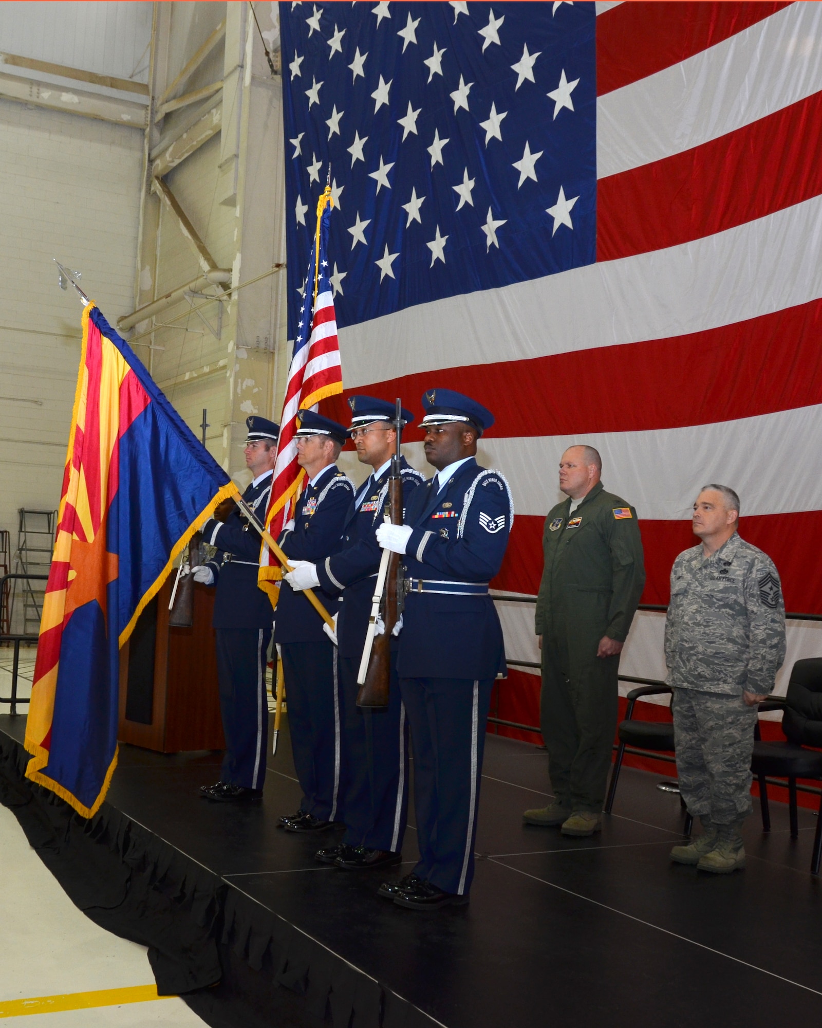 Members of the 161st Air Refueling Wing Honor Guard present the flag during the opening ceremony of Hometown Heroes Salute at the 161st ARW, Phoenix, March 9, 2013. This is the fourth Annual event and is unique because it also recognizes Airmen’s families and others who do not wear the uniform, but who sacrifice nonetheless. (U.S. Air Force photo by Senior Airman Rashaunda Williams/Release)