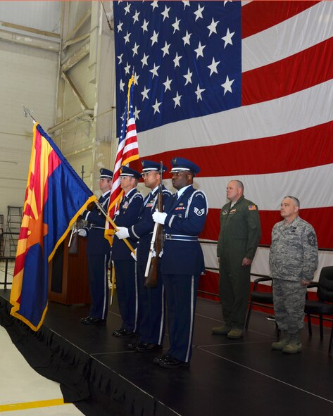 Members of the 161st Air Refueling Wing Honor Guard present the flag during the opening ceremony of Hometown Heroes Salute at the 161st ARW, Phoenix, March 9, 2013. This is the fourth Annual event and is unique because it also recognizes Airmen’s families and others who do not wear the uniform, but who sacrifice nonetheless. (U.S. Air Force photo by Senior Airman Rashaunda Williams/Release)