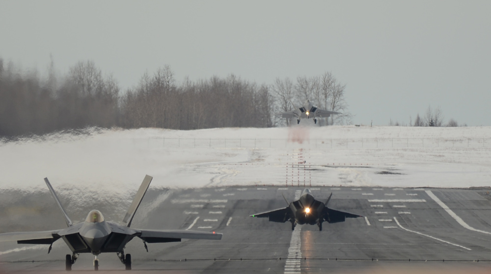 Three Raptors land at Joint Base Elmendorf Richardson, Alaska March 9. The Raptors were flown by Reserve pilots assigned to the 302nd Fighter Squadron during the 477th Fighter Groups monthly training weekend. During the week the 477th Fighter Group, Alaska's only Reserve unit, integrates with the active duty 3rd Wing. (U.S. Air Force Reserve/Tech. Sgt. Dana Rosso) 