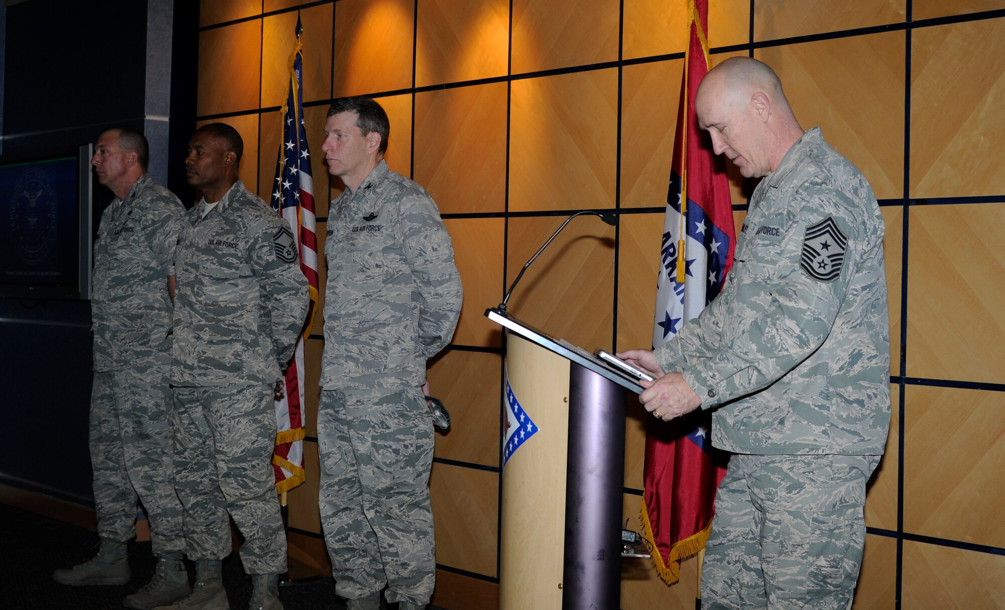 Command Chief Master Sgt. Stephen Bradley speaks about the duties of E-9 as Col. Pete Gauger, 188th Fighter Wing vice commander; then-Senior Master Sgt. Kerry Mitchell, 188th human resources advisor; and Col. Mark Anderson 188th Fighter Wing commander participate in a promotion ceremony at the 188th March 2. Mitchell was promoted to E-9 during the event. (National Guard photo by Senior Airman Hannah Landeros/188th Fighter Wing Public Affairs)
