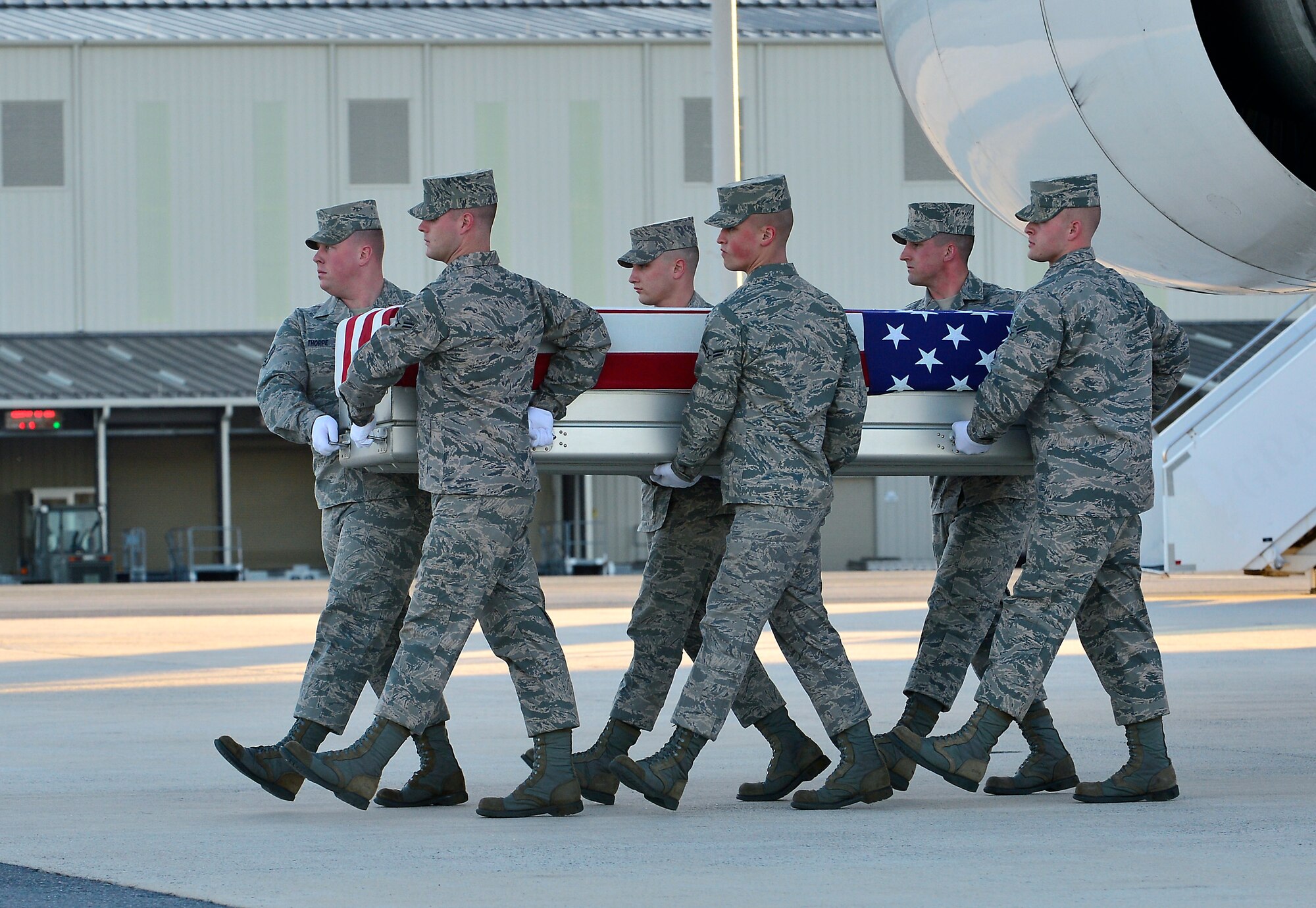 A U.S. Air Force carry team transfers the remains of Tech. Sgt. Larry D. Bunn, 43, of Bossier City, La., at Dover Air Force Base, Del., on March 9, 2013. Bunn was assigned to the 307th Maintenance Squadron at Barksdale Air Force Base, La. (U.S. Air Force photo/David S. Tucker)