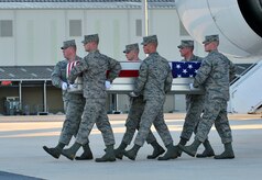 A U.S. Air Force carry team transfers the remains of Tech. Sgt. Larry D. Bunn, 43, of Bossier City, La., at Dover Air Force Base, Del., on March 9, 2013. Bunn was assigned to the 307th Maintenance Squadron at Barksdale Air Force Base, La. (U.S. Air Force photo/David S. Tucker)