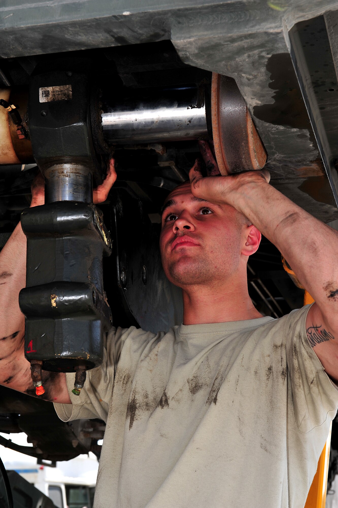 U.S. Air Force Airman 1st Class Travis Martin, 380th Logistics Readiness Squadron vehicle maintenance journeyman, replaces the side shift and roll cylinder on a 25K Next Generation Small Loader at an undisclosed location in Southwest Asia Mar. 5, 2013. The vehicle maintenance shop is responsible for the service and repair of a 900 vehicle fleet. Martin is deployed from Cannon Air Force Base, N.M. (U.S. Air Force photo by Tech. Sgt. Christina M. Styer/Released) 