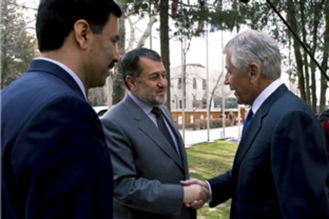 U.S. Defense Secretary Chuck Hagel shakes hands with Afghan Defense Minister Bismillah Khan Mohammadi in Kabul, Afghanistan, March 10, 2013. Hagel traveled to Afghanistan on his first trip as the 24th defense secretary to visit U.S. troops, NATO leaders and Afghan counterparts.