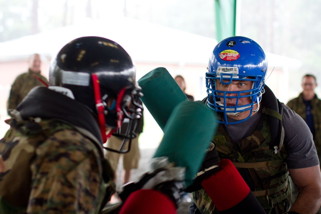 Educators from the Western Pennsylvania recruiting region participate in a pugil stick bout Feb. 6 during a Marine Corps Martial Arts Program brief aboard Marine Corps Recruit Depot Parris Island, S.C. The educator’s workshop is designed to bring local educators face-to-face with the effort and energy needed to make America's Marines.