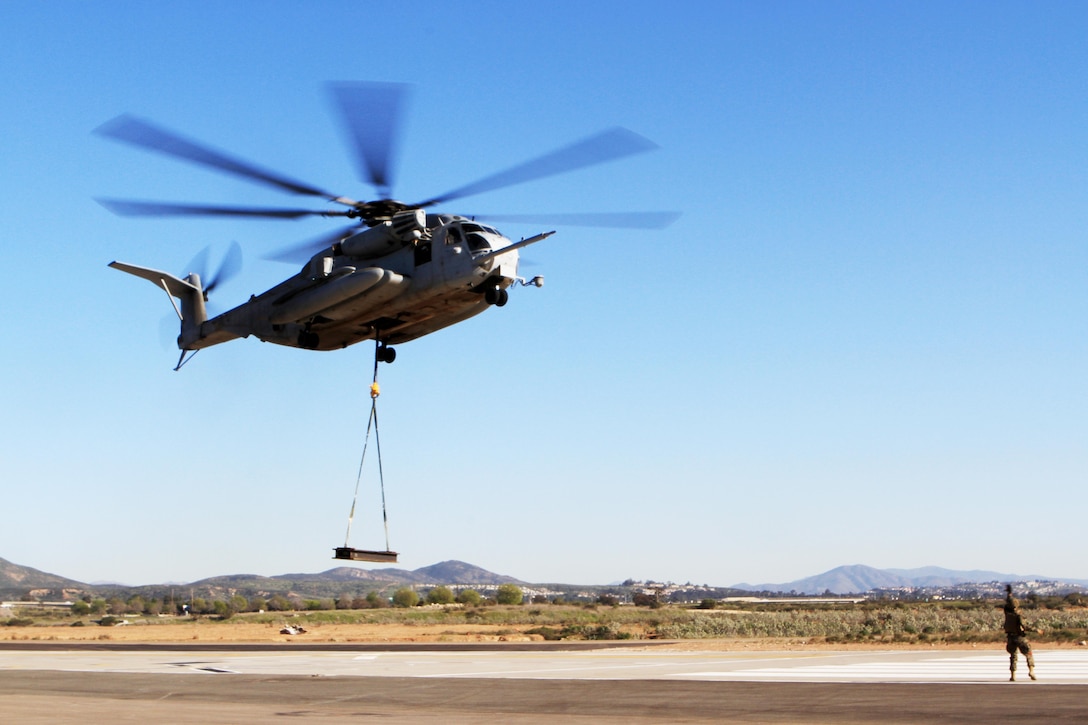 A CH-53E Super Stallion with Marine Heavy Helicopter Squadron 466, “Wolfpack,” 3rd Marine Aircraft Wing, practices external lifts aboard Marine Corps Air Station Miramar, Calif., Feb. 28. The Super Stallion is toting a 6,200-pound load from a single-point sling, simulating external cargo transport as it would occur in areas of operation such as Afghanistan.