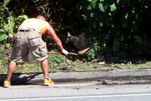 Lance Cpl. Erik Estrada helps with a curb restoration project March 8, during Exercise Guahan Shield. Guahan Shield is an exercise designed to facilitate multiservice engagement and provide potential rapid response to theater crises and contingency operations in the Asia-Pacific region. Estrada is with Combat Logistics Detachment 39, part of 3rd Marine Logistics Group.
