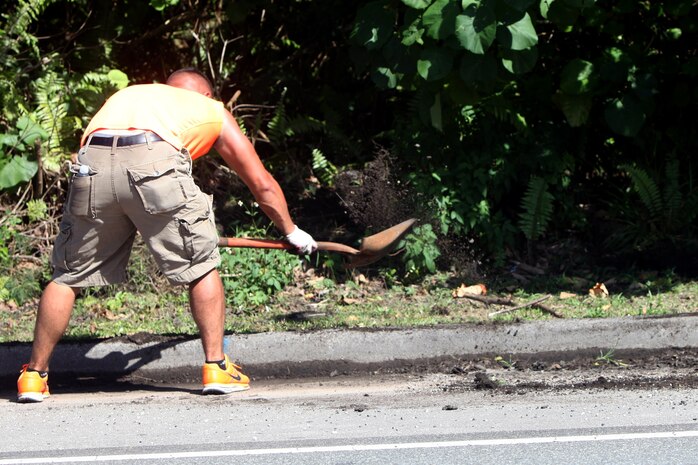 Lance Cpl. Erik Estrada helps with a curb restoration project March 8, during Exercise Guahan Shield. Guahan Shield is an exercise designed to facilitate multiservice engagement and provide potential rapid response to theater crises and contingency operations in the Asia-Pacific region. Estrada is with Combat Logistics Detachment 39, part of 3rd Marine Logistics Group.

