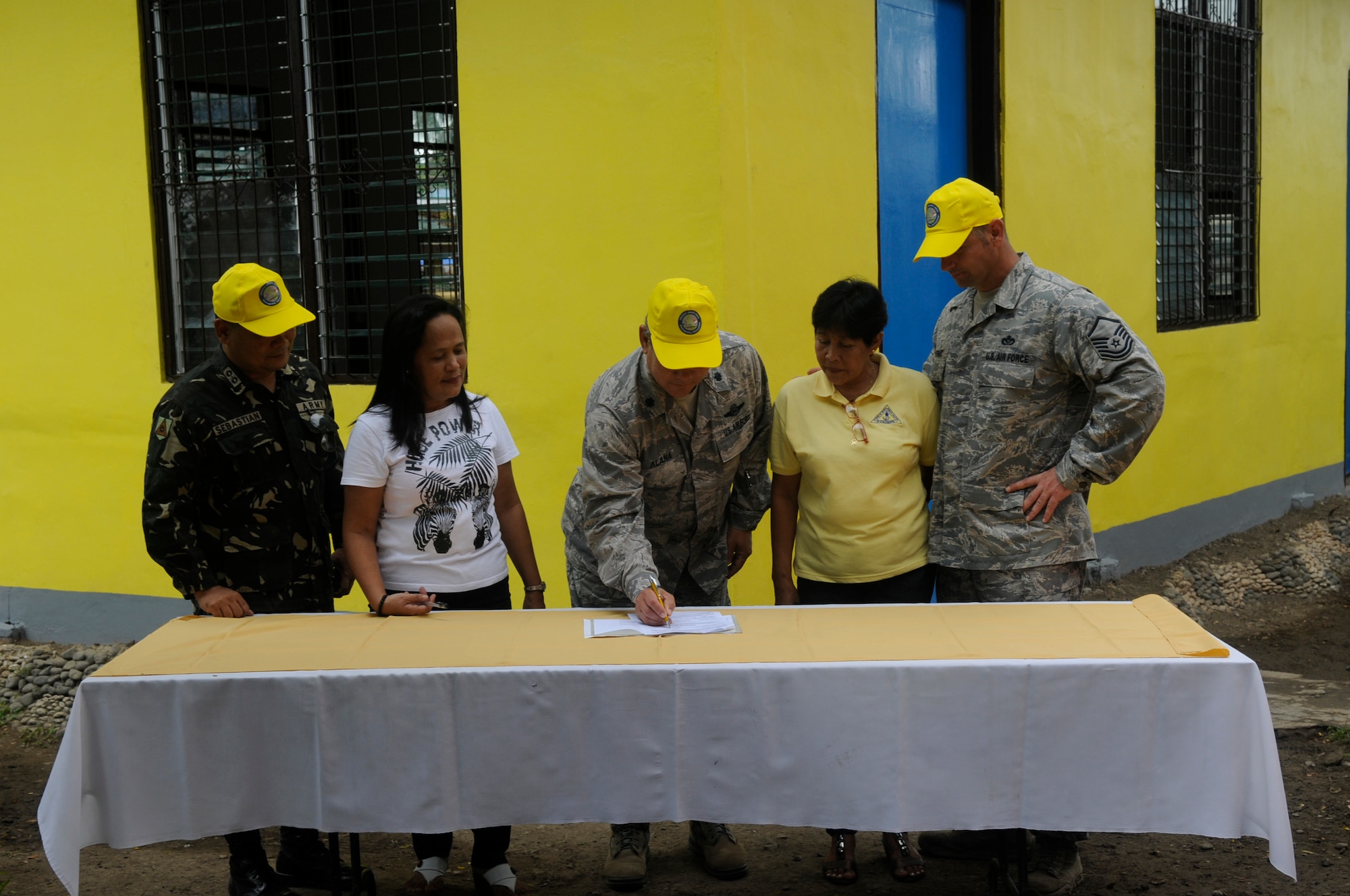 American and Filipino Operation Pacific Angel-Philippines leaders joined school officials to formally hand over a completed building at Pamplona, Philippines, March 9, 2013. A team of engineers completely renovated the building including electrical, drywall, windows and painting. Operation Pacific Angel is a joint and combined humanitarian assistance exercise held in various countries several times a year and includes medical, dental, optometry, engineering programs and various subject-matter expert exchanges. (U.S. Air Force photo/Senior Master Sgt. J.C. Woodring)