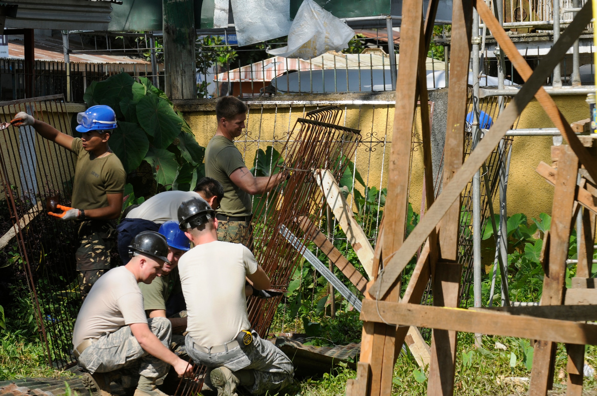 A team of American and Filipino Operation Pacific Angel-Philippines engineers begin a building renovation at an elementary school in Pamplona, Philippines, March 3, 2013. The renovations included electrical, drywall, windows and painting. Operation Pacific Angel is a joint and combined humanitarian assistance exercise held in various countries several times a year and includes medical, dental, optometry, engineering programs and various subject-matter expert exchanges. (U.S. Air Force photo/Senior Master Sgt. J.C. Woodring)