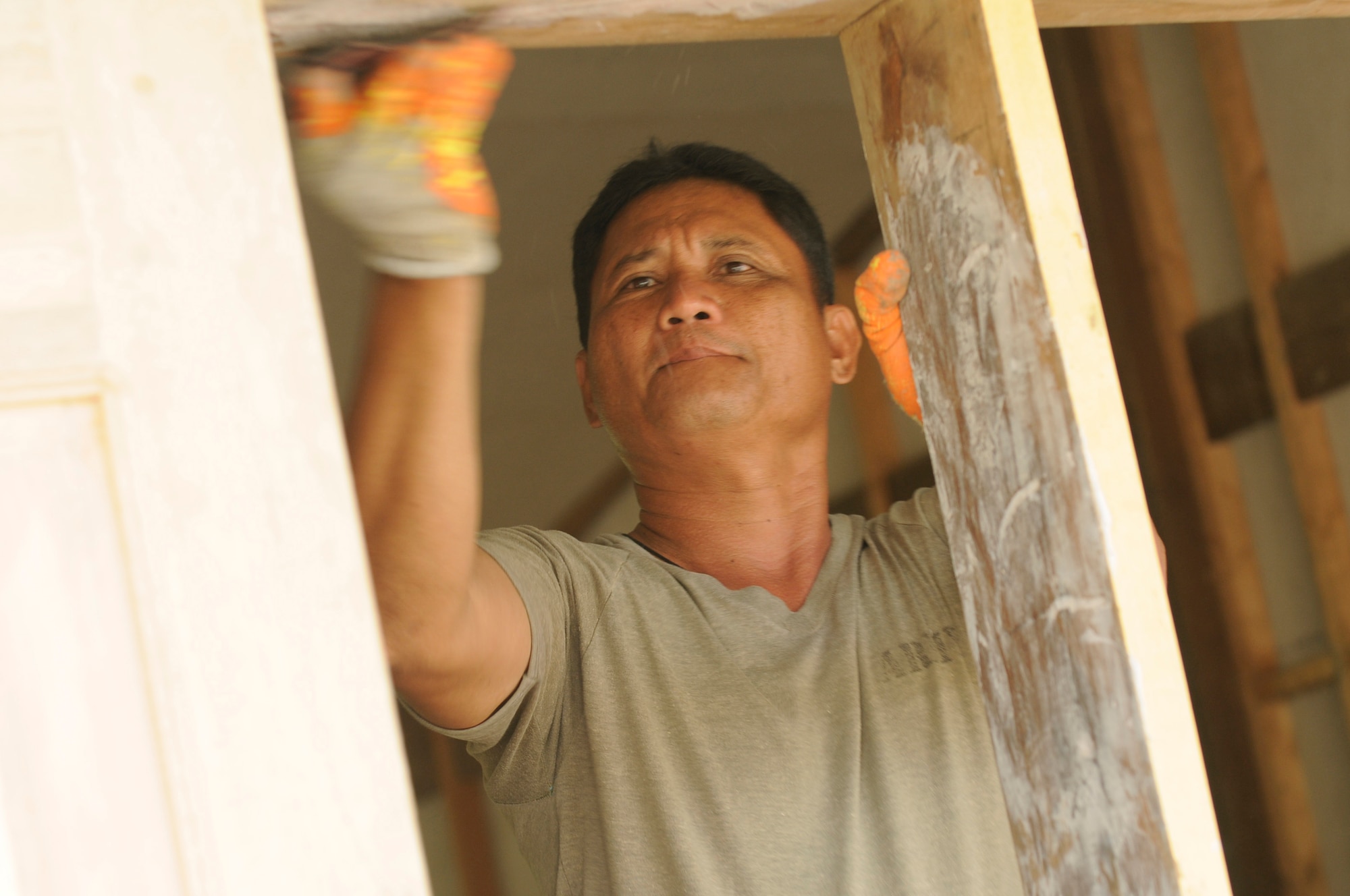 Armed Forces of the Philippines Staff Sgt. Boca begins renovation on a building at Amlan, Philippines, on March 5, 2013. The renovation is part of a bilateral Operation Pacific Angel-Philippines mission with the U.S. and Philippines. Operation Pacific Angel is a joint and combined humanitarian assistance mission held in various countries several times a year and includes medical, dental, optometry, engineering programs and various subject-matter expert exchanges. (U.S. Air Force photo/Senior Master Sgt. J.C. Woodring) 