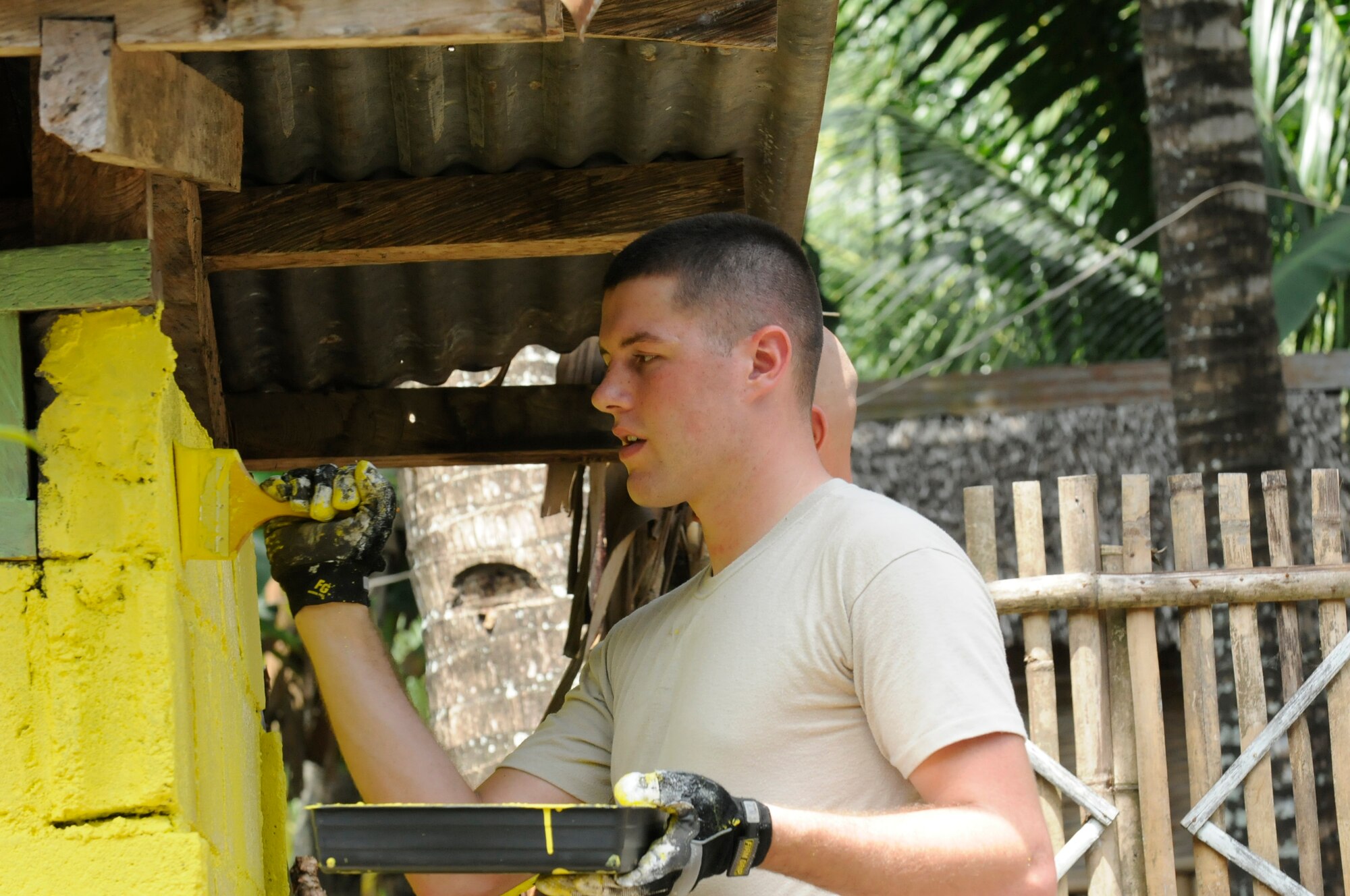 U.S. Air Force Senior Airman Taylor Vondrasek paints a restroom at an elementary school in Dauin, Philippines, March 7, 2013, as part of Operation Pacific Angel-Philippines. Vondrasek is from Andersen Air Force Base, Guam, and this is his second time on the mission to the country. The Dauin site is one of three improved by civil engineers during the mission. Operation Pacific Angel is a joint and combined humanitarian assistance exercise held in various countries several times a year and includes medical, dental, optometry, engineering programs and various subject-matter expert exchanges. (U.S. Air Force photo/Senior Master Sgt. J.C. Woodring)