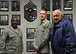 Chief Master Sgt. Eric Johnson, 82d Training Wing command chief, Senior Airman Brent Donaldson and Chief Master Sgt. (ret) Clifford O’Neal stand next to O’Neal’s photo. O’Neal as well as Donaldson’s grandfather were both former command chiefs for the 82 TRW. (U.S. Air Force Photo/Kimberly Parker)