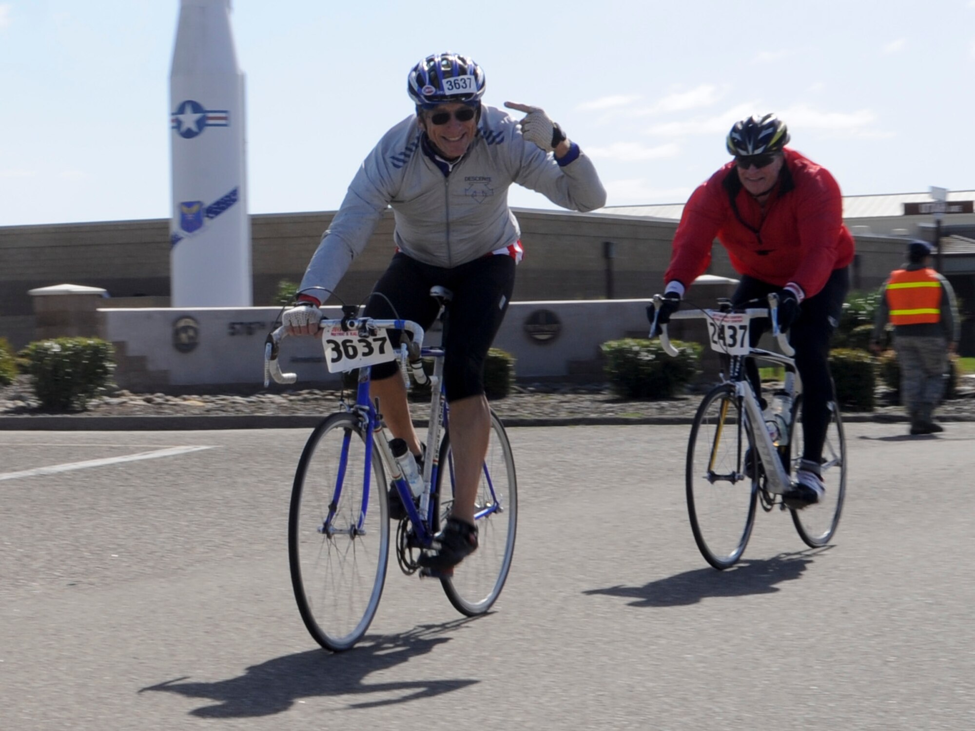 VANDENBERG AIR FORCE BASE, Calif. – A biker points at his bib number while riding through Vandenberg here Saturday, March 9, 2013. Nearly 1,500 riders participated in a 100-mile century ride, 14 of those miles through Vandenberg Air Force Base. (U.S. Air Force photo/Airman Yvonne Morales)