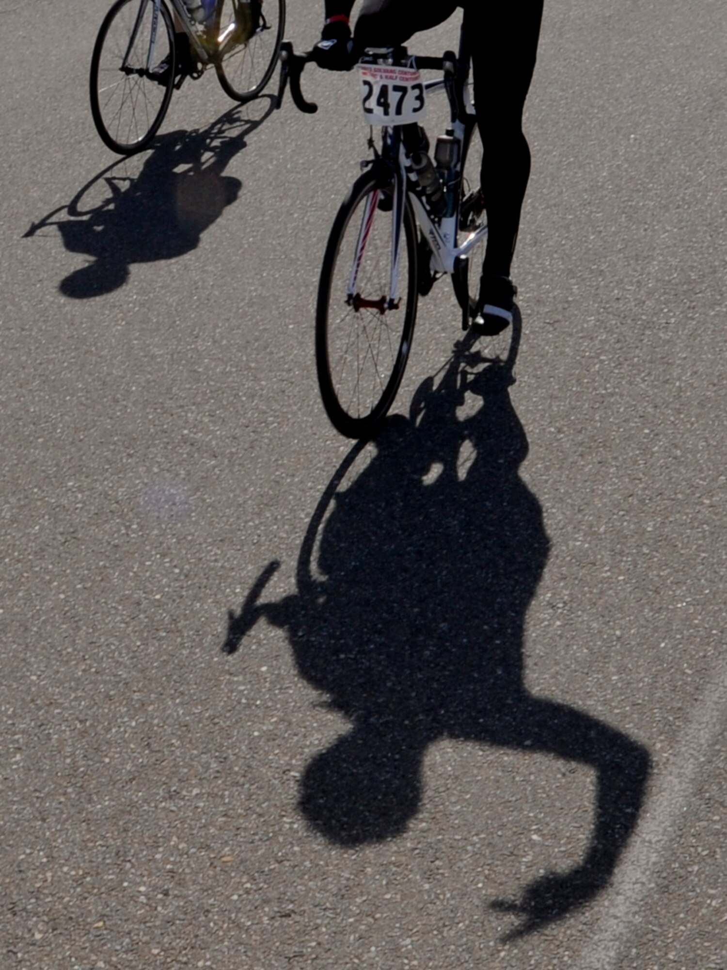 VANDENBERG AIR FORCE BASE, Calif. – A biker with the Specialized Coronary Outpatient Rehabilitation Cardiac Cyclist Club Inc. passes through Vandenberg here Saturday, March 9, 2013. Nearly 1,500 riders participated in a 100-mile century ride, 14 of those miles through Vandenberg Air Force Base. (U.S. Air Force photo/Airman Yvonne Morales)
