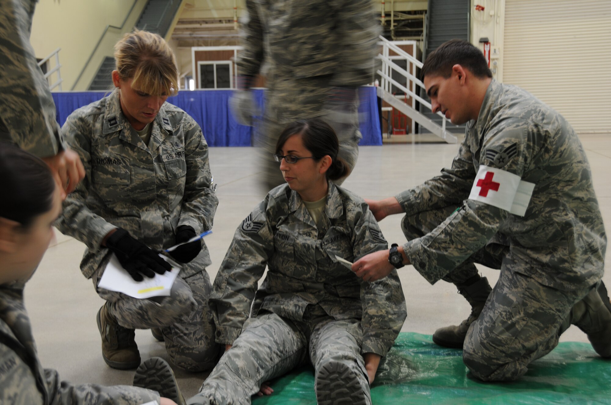Members from the 944th MDS and 944th ASTS, Luke AFB, Ariz., document patient information during an annual mass casualty exercise held at Luke Air Force Base, Ariz. (U.S. Air Force photo/Staff Sgt. Joshus Nason)