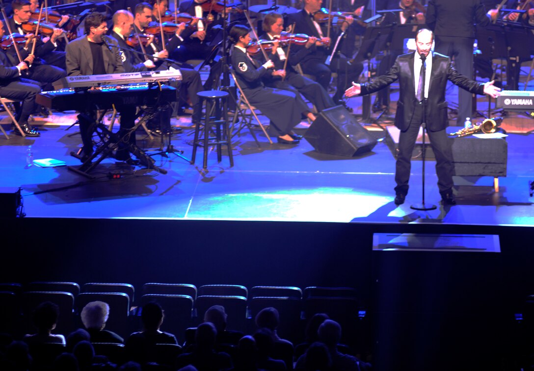 Singing alongside the Air Force Band, Grammy Award winner Lee Greenwood performs for fans during the final installment of the U. S. Air Force Band's Guest Artist Series March 10, 2013 at DAR Constitution Hall in Washington, D.C. Other artists highlighted during this year's series include Melina Leon and The Rogues. (U.S. Air Force photo/Senior Airman Lindsey A. Porter)
