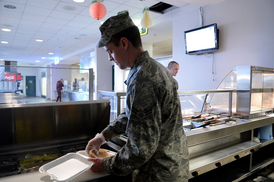 U.S. Air Force Airman 1st Class Greg Steele, 20th Force Support Squadron food service apprentice, makes a sandwich at the Chief Emerson Dining Facility, Shaw Air Force Base, S.C., March 6, 2013.  The dining hall ensures the health and wellness of more than 500 military personnel whom they serve daily. (U.S. Air Force photo by Airman 1st Class Nicole Sikorski/Released)